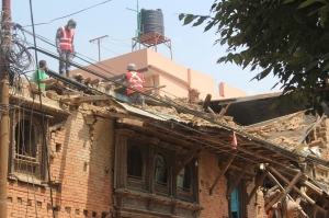 Security personnel dismantling cracked house at Sankhu 